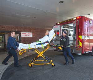 Richard Young (left), firefighter/AEMT with Norfolk Fire-Rescue, and Heather Joyner, firefighter/paramedic with Norfolk Fire-Rescue, deliver a patient to Bon Secours DePaul Medical Center in Norfolk, Va. (Photo/Richard Muldez, Bon Secours Hampton Roads Health System)