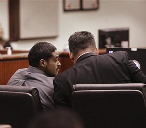 John Hernandez Felix confers with his attorney Michael Rowlands in the Indio Larson Justice Center on Thursday, Oct. 13, 2016 in Indio, Calif.
