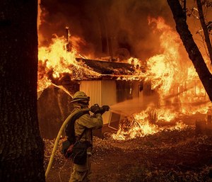 Texas legislators are considering a bill that would make it illegal for telecommunications companies to “throttle” mobile data in declared disaster zones. (Photo/AP)