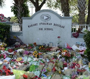 Students visit memorial for Stoneman Douglas High School Shooting victims on February 23, 2018 in Parkland, Florida.