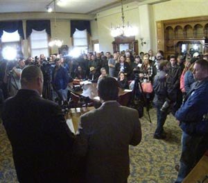 Union and community members crowd into a City Hall room in Milwaukee on Thursday, Oct. 16, 2014 during a news conference to protest the firing of a Milwaukee police officer in connection to the fatal shooting of a mentally ill man in a downtown park. (AP Image)