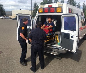 Always lift and move the patient cot with a partner. (Photo/Santa Rosa Junior College)