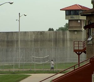 An inmate walks in the yard at Pendleton Correctional Facility in Pendleton, Indiana.