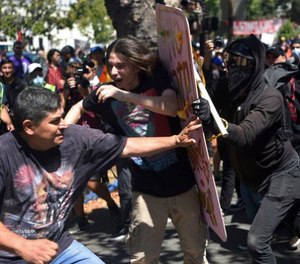 In this Aug. 27, 2017 file photo, demonstrators clash during a free speech rally in Berkeley, Calif. (AP Photo/Josh Edelson, File)