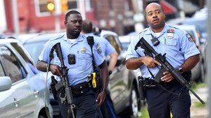 Police officers wearing body cameras respond to a shooting in Philadelphia in August. Image: Mark Makela/Getty Images