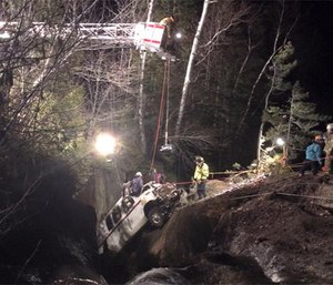 Crews extricating the vehicle from the river. (Photo courtesy Rangeley Fire Department Facebook page)