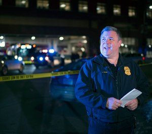 Minneapolis Police Public Information Officer John Elder briefs reporters on the shooting of two people on a bus, Feb. 6, 2020, in Minneapolis.