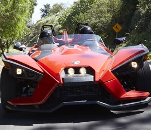 The Slingshot is a topless roadster but is equipped with waterproof seats and lockable storage bins.