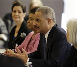 Attorney General Eric Holder speaks during a building community trust roundtable discussion with law enforcement, elected officials and community leaders Thursday, Feb. 5, 2015, in Oakland, Calif.