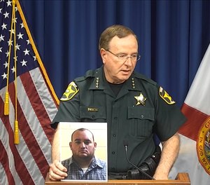 Sheriff Grady Judd holds a press conference about the arrest of former deputy Peter Heneen in Winter Haven, Fla.