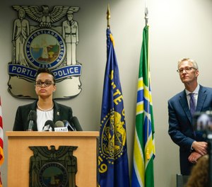 Portland Police Chief Danielle Outlaw and Mayor Ted Wheeler pictured in 2017. (Photo/Stephanie Yao Long/The Oregonian)