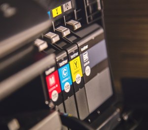 Police say an Ohio man huffing red printer ink fought with paramedics and police officers before being taken to the hospital.