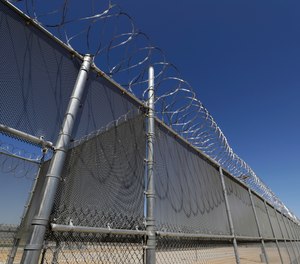 This Wednesday, Aug. 28, 2019, photo shows the Adelanto U.S. Immigration and Enforcement Processing Center operated by GEO Group, Inc. (GEO) a Florida-based company specializing in privatized corrections in Adelanto, Calif.
