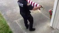 Video: Officer praised after picking up American flag off the ground