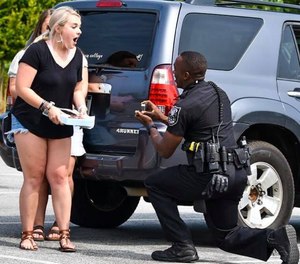 DeKalb County Police Department's Officer John Heart proposing to his girlfriend, Alexis (Photo / Gwinnett County Sheriff's Office)