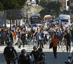 Protestors rally in downtown Los Angeles, against a police shooting of a homeless man on Tuesday, March 3, 2015. (AP Image)