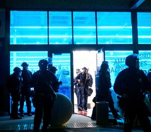n this May 30, 2020, file photo, police officers leave a vandalized Decathlon sporting goods store in Emeryville, Calif.