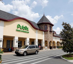 In this Sunday, May 19, 2013 file photo, a vehicle passes the front of the Publix supermarket in Zephyrhills, Fla. (AP Photo/Scott Iskowitz, File)