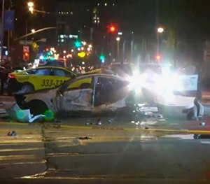 This Feb. 6, 2016 image provided by KPIX CBS 5 shows police and fire officials responding after a car crash that killed three on a San Francisco street. (KPIX CBS 5 via AP)