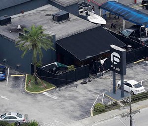 In this June 12, 2016 file photo, law enforcement officials work at the Pulse gay nightclub in Orlando, Fla., following the a mass shooting.