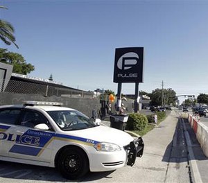 In this June 22, 2016, file photo, traffic moves along Orange Avenue after authorities opened the streets around the Pulse nightclub, scene of a recent mass shooting in Orlando, Fla. (AP Image)