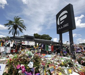 In this July 11, 2016, file photo, a makeshift memorial continues to grow outside the Pulse nightclub in Orlando, the day before the one month anniversary of a mass shooting, in Orlando, Fla. (Photo/TNS)