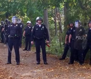 In this photo provided by Seth Meyer police officers line up. Local police, firefighters and ambulances in New Hampshire responded to large crowds of students as the annual Pumpkin Festival is underway near Keene State College Saturday, Oct. 18, 2014. (AP Image)