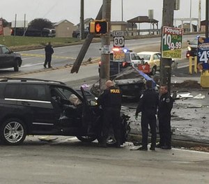 Police investigate the scene of a multi-vehicle crash at the intersection of Route 30 and Route 48, Thursday, Nov. 24, 2016, in North Versailles, Pa.