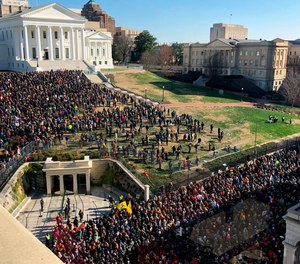 Thousands of gun-rights activists leave the Capitol grounds after a rally protesting gun-control legislation ended peacefully Monday, Jan. 20, 2020, in Richmond, Va.