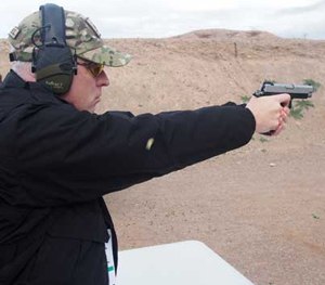 P1 Editor in Chief Doug Wyllie shoots the Springfield Armory 1911 Range Officer in forged stainless steel at SHOT Show 2016.