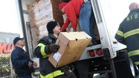 Conn. firefighters load hundreds of turkeys for those in need