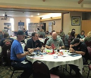 South Dakota Ambulance Association attendees, paid and volunteer, work together on action plans for recruitment, public relations and leadership using SWOT analysis.