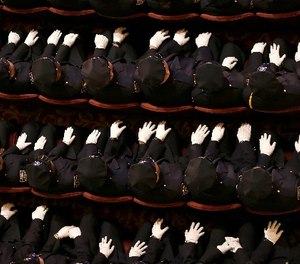 New police officers attend their graduation ceremony at the Beacon Theatre in New York, Thursday, Dec. 28, 2017.