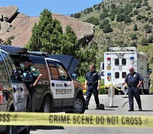 Police guard the south entrance to Red Rocks Amphitheater, in Morrison, Colo., Friday June 20, 2014. (AP Image)