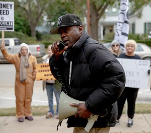 Rodrick Reed leads a chant during a protest against the execution of Rodney Reed. A growing number of politicians and celebrities have joined calls to further examine Reed's case before his execution proceeds. (Photo/Nick Wagner/Austin American-Statesman via AP)