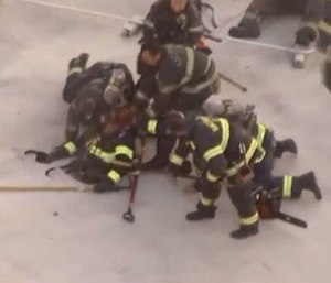 A veteran firefighter was rescued by colleagues after nearly falling through a roof while battling a blaze. (Photo/KCRA)