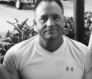 Longtime paramedic Rodney Gilmer, 50, was shot in the abdomen at his home, according to Anderson County Deputy Coroner Don McCown.