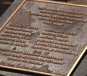 The names of the first Black firefighters in Virginia are memorialized on a plaque.