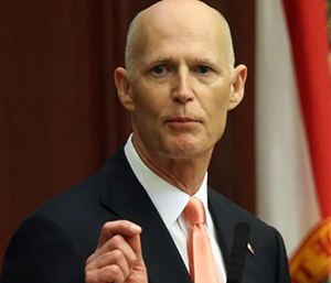 Florida Gov. Rick Scott called for more vigilance against the Zika virus and he said his emergency health declaration for five counties was much like getting ready for hurricane. (AP Photo/Steve Cannon, File)
