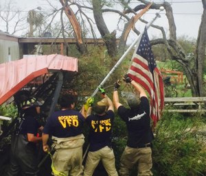 First responders – police, fire and EMS – have banded together from all over the U.S. to help save those affected by the powerful storm. (Photo/State Firefighters’ and Fire Marshals’ Association of Texas)