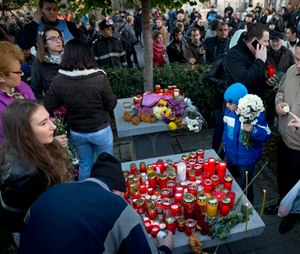As the nation entered its second day of mourning, thousands paid their respects at the Colectiv nightclub in Bucharest. (AP Photo/Vadim Ghirda)