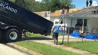 Fla. firefighters repair roof damaged by hurricane