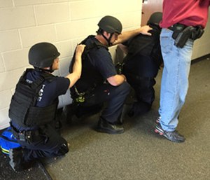 An RTF team of police officers and paramedics enters the warm zone to find, triage, and treat patients with life-threatening injuries.