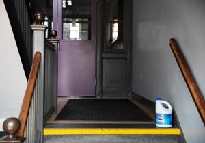 A bottle of bleach sits on the steps of Saint Raphael Academy in Pawtucket, R.I. Image: AP Photo/David Goldman