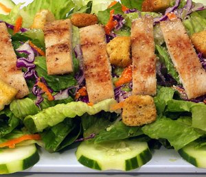 A green salad with a seasoned chicken breast can help power you through a shift. Just keep the dressing in a separate container.