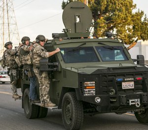 In this Dec. 2, 2015 file photo authorities search an area near where police stopped a suspected vehicle in San Bernardino, Calif. State lawmakers want to see if lessons can be learned from the way first-responders reacted to the San Bernardino terror attack that killed 14 people last year.