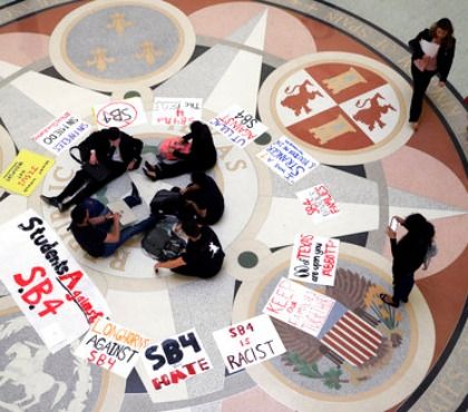 Students gather in the Rotunda at the Texas Capitol to oppose SB4, an anti-