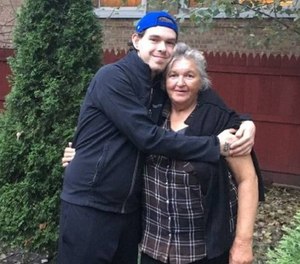Maria Ursu and her son pose together after police helped them reunite.