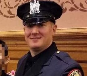 Detective Joseph Seals was fatally shot Tuesday before two armed gunmen barricaded themselves inside a market.