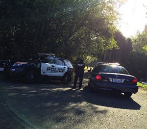 Police block the road leading to a Mukilteo, Wash., house where several people were killed and injured in a shooting early Saturday.